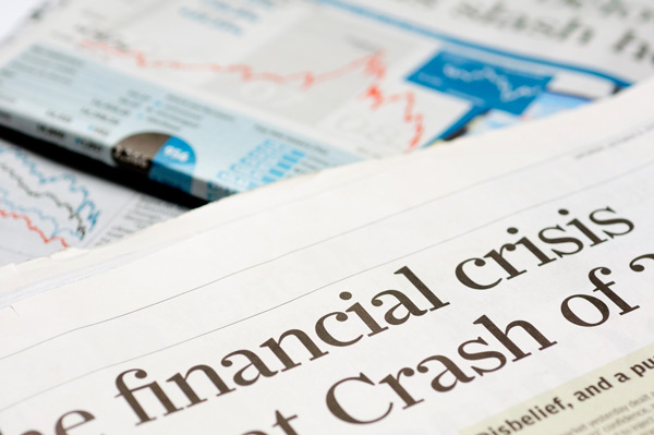 Newspaper showing financial crisis headline