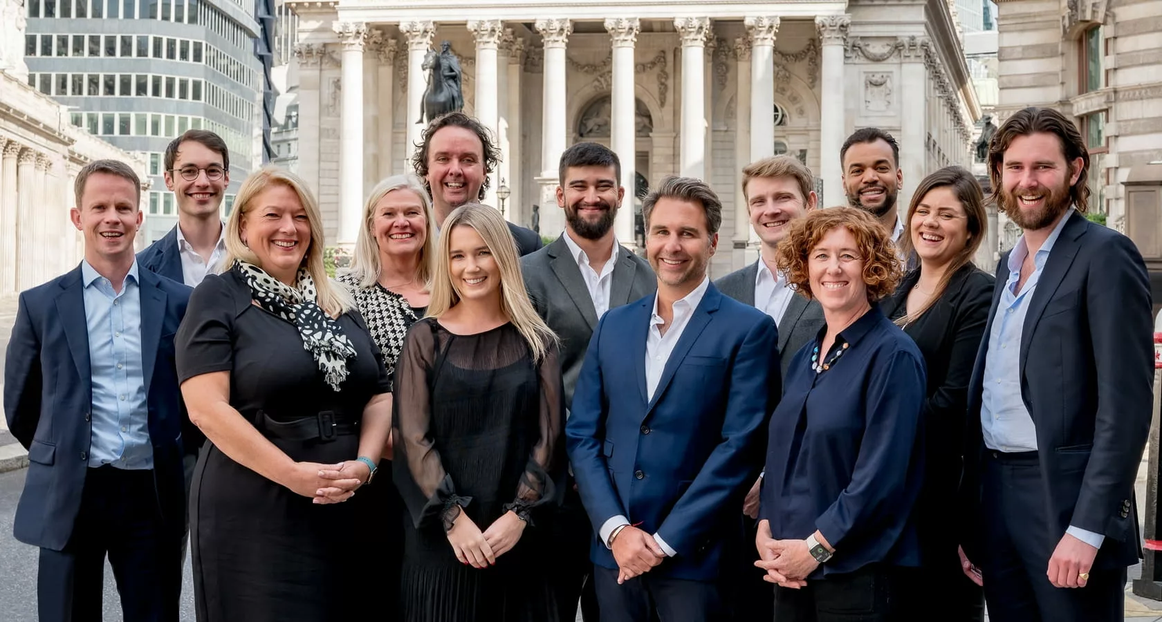 The team at The Pietra Sussan Company outside The Royal Exchange in London